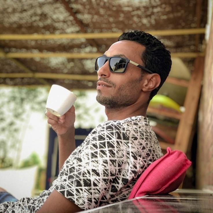 Avery Chen, Lead Design Curator at Island Crest Pro, reviewing corporate floral arrangements