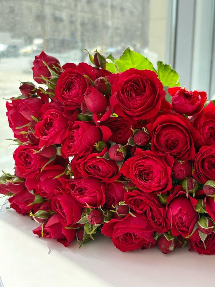 Corporate meeting room with carefully timed floral arrangements that maintain elegance throughout business hours